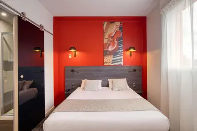Un ou plusieurs lits dans un hébergement de l'établissement Best Western Hotel Atlantys Zenith Nantes