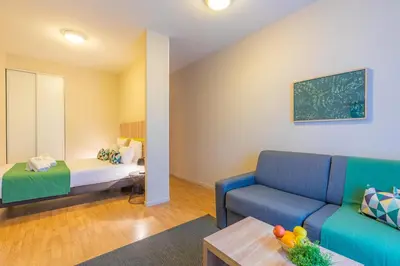 Un ou plusieurs lits dans un hébergement de l'établissement Appart’City Confort Nantes Centre