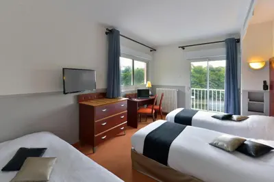 Un ou plusieurs lits dans un hébergement de l'établissement Contact Hotel Le Moulin Neuf Chantonnay
