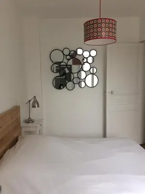 Un ou plusieurs lits dans un hébergement de l'établissement Appartements de Jules & Victoire