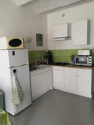Cuisine ou kitchenette dans l'établissement Gite Duguesclin