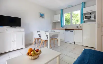 Cuisine ou kitchenette dans l'établissement Résidence Odalys Le Domaine de l'Océan