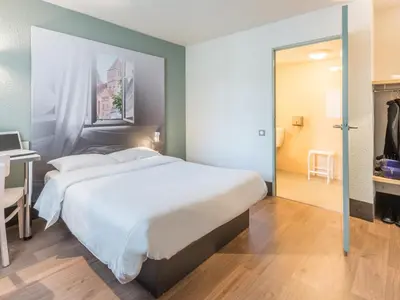 Un ou plusieurs lits dans un hébergement de l'établissement B&B HOTEL Angers 2 Université