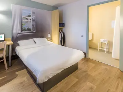 Un ou plusieurs lits dans un hébergement de l'établissement B&B HOTEL Angers 2 Université
