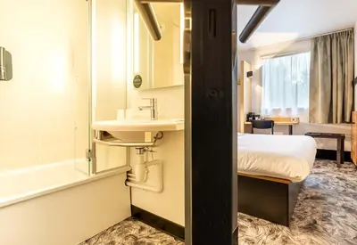 Un ou plusieurs lits dans un hébergement de l'établissement B&B HOTEL Nantes Atlantis Le Zénith 3 étoiles