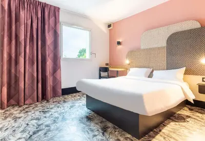 Un ou plusieurs lits dans un hébergement de l'établissement B&B HOTEL Nantes Atlantis Le Zénith 3 étoiles