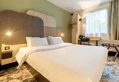 Un ou plusieurs lits dans un hébergement de l'établissement B&B HOTEL Nantes Atlantis Le Zénith 3 étoiles