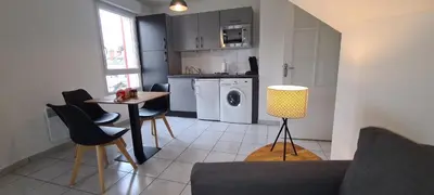 Cuisine ou kitchenette dans l'établissement Appart'Hôtel - Chateaubriant