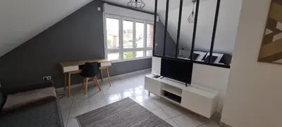 Télévision ou salle de divertissement dans l'établissement Appart'Hôtel - Chateaubriant