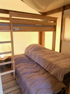 Un ou plusieurs lits dans un hébergement de l'établissement Camping Capfun La Bretèche
