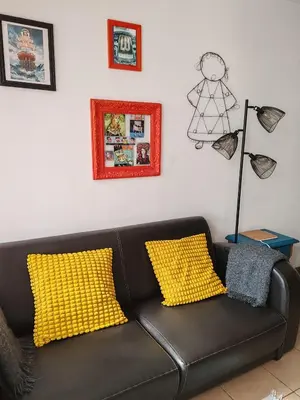 Coin salon dans l'établissement Appartement T2 sur cour nantaise