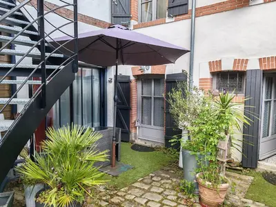 Jardin de l'établissement Appartement T2 sur cour nantaise