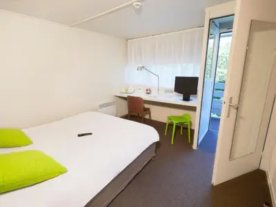 Un ou plusieurs lits dans un hébergement de l'établissement Campanile Nantes ~ Rezé Aéroport
