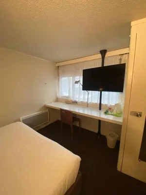 Un ou plusieurs lits dans un hébergement de l'établissement Campanile Nantes ~ Rezé Aéroport