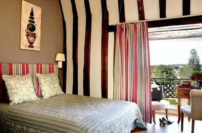 Un ou plusieurs lits dans un hébergement de l'établissement Chateau Colbert