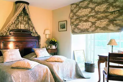 Un ou plusieurs lits dans un hébergement de l'établissement Chateau Colbert