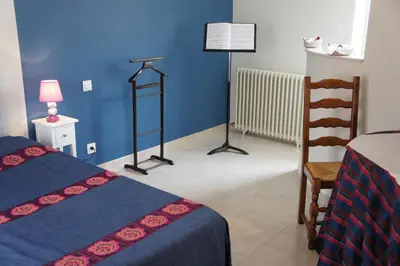 Un ou plusieurs lits dans un hébergement de l'établissement La chambre du harpiste