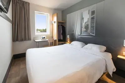 Un ou plusieurs lits dans un hébergement de l'établissement B&B HOTEL Nantes Rezé St Sébastien