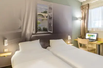 Un ou plusieurs lits dans un hébergement de l'établissement B&B HOTEL Nantes Rezé St Sébastien