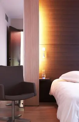 Un ou plusieurs lits dans un hébergement de l'établissement Hôtel Oceania Nantes Aéroport