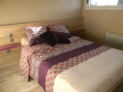 Un ou plusieurs lits dans un hébergement de l'établissement Maison Landreau