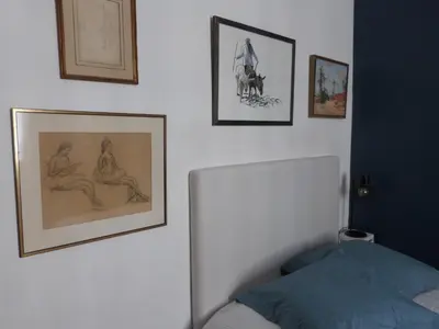 Un ou plusieurs lits dans un hébergement de l'établissement Chambre d'hôtes La grotte de Voltaire