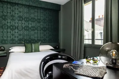 Un ou plusieurs lits dans un hébergement de l'établissement LHotel - face au château - boutique hôtel et séminaires