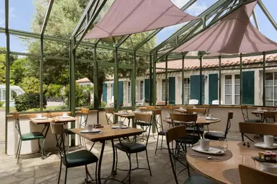 Restaurant ou autre lieu de restauration dans l'établissement Domaine Le Martinet, The Originals Relais