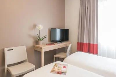 Un ou plusieurs lits dans un hébergement de l'établissement Appart'City Classic Nantes Quais de Loire