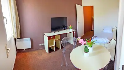 Télévision ou salle de divertissement dans l'établissement Appart'City Classic Saint-Nazaire Centre