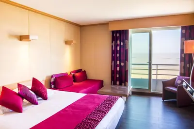 Un ou plusieurs lits dans un hébergement de l'établissement Hôtel Spa du Beryl St Brévin l'Océan
