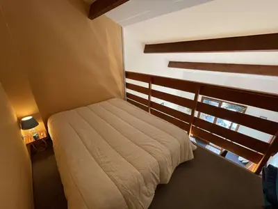Un ou plusieurs lits dans un hébergement de l'établissement Studio mezzanine avec jardinet et piscine à Saint-Jean-de-Monts, 4 couchages - FR-1-224C-71