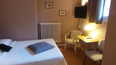 Un ou plusieurs lits dans un hébergement de l'établissement Hôtel Le Cambronne