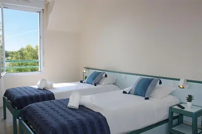 Un ou plusieurs lits dans un hébergement de l'établissement Azureva Club Pornichet Baie de La Baule