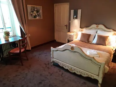 Un ou plusieurs lits dans un hébergement de l'établissement Hôtel De La Barbacane