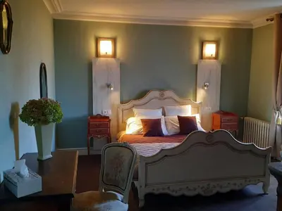 Un ou plusieurs lits dans un hébergement de l'établissement Hôtel De La Barbacane