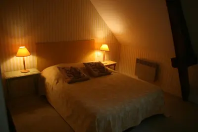 Un ou plusieurs lits dans un hébergement de l'établissement Le Loft du Grand Saulaie