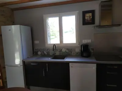 Cuisine ou kitchenette dans l'établissement Au Fil de l'Eau