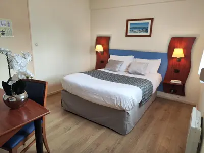 Un ou plusieurs lits dans un hébergement de l'établissement Hôtel Estuaire