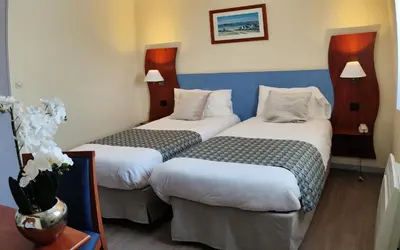 Un ou plusieurs lits dans un hébergement de l'établissement Hôtel Estuaire
