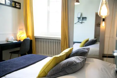 Un ou plusieurs lits dans un hébergement de l'établissement Logis Auberge De L'ombrée