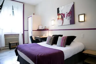 Un ou plusieurs lits dans un hébergement de l'établissement Logis Auberge De L'ombrée