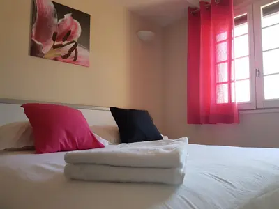 Un ou plusieurs lits dans un hébergement de l'établissement Hôtel Le Sainte Florence