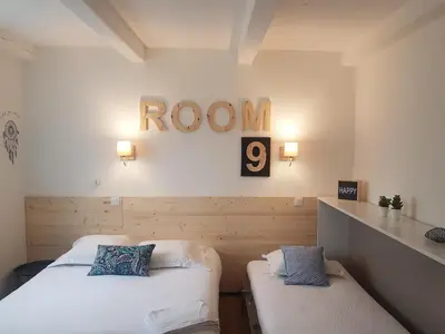 Un ou plusieurs lits dans un hébergement de l'établissement Hôtel Le Sainte Florence