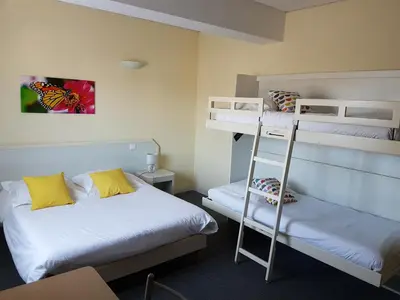 Un ou plusieurs lits dans un hébergement de l'établissement Hôtel Le Sainte Florence