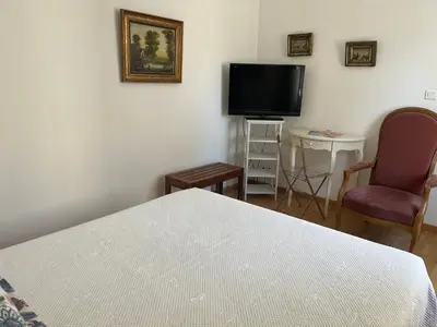 Télévision ou salle de divertissement dans l'établissement La Ferme du Preneau