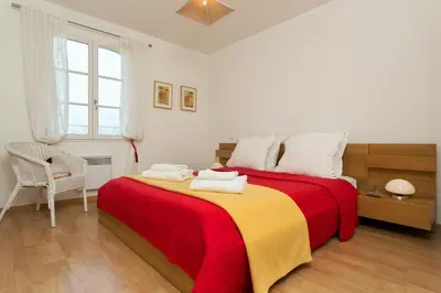 Un ou plusieurs lits dans un hébergement de l'établissement Madame Vacances Les Villas de Fontenelles