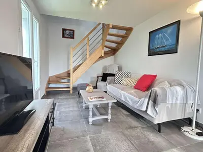 Télévision ou salle de divertissement dans l'établissement Maison neuve près des dunes avec jardin clos, 3 chambres et tout confort, à 800m de la plage - FR-1-224B-548