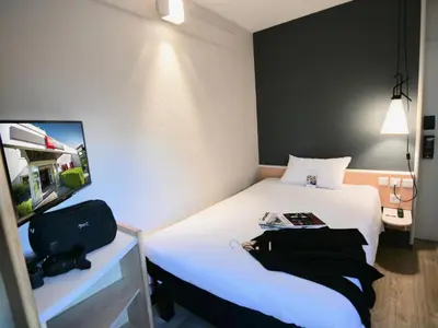 Un ou plusieurs lits dans un hébergement de l'établissement Ibis Nantes la Beaujoire Parc Expo
