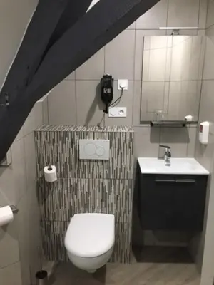 Salle de bains dans l'établissement Le Relais